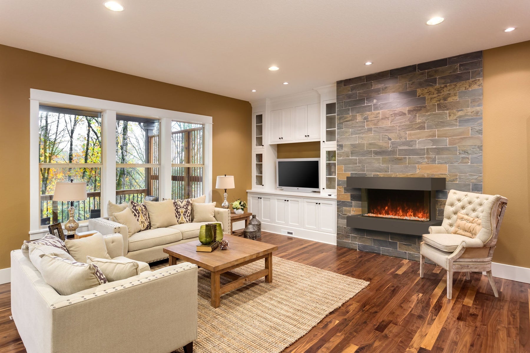 Modern Flames Landscape Pro Multi electric fireplace wall-mounted in a bright contemporary family room above a gray sectional sofa