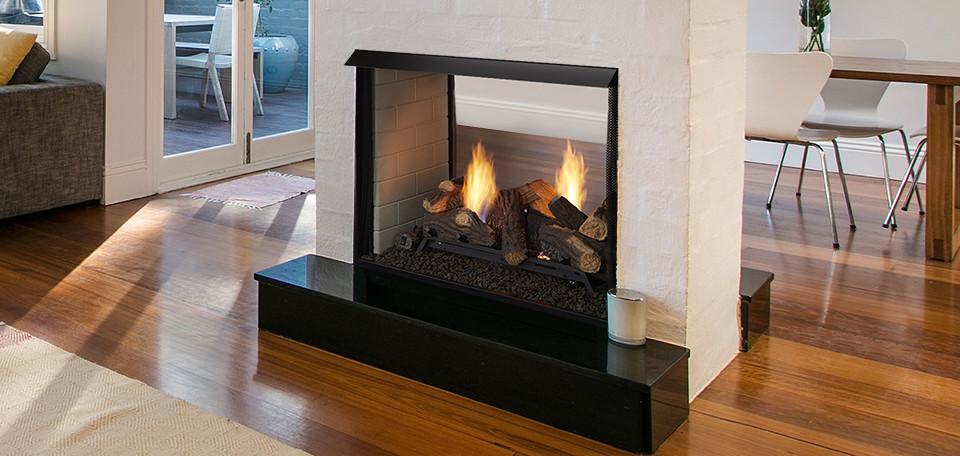 Monessen Lo-Rider vent-free gas firebox installed as a see-through room divider