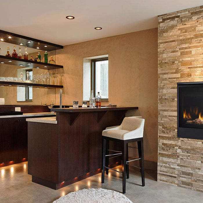 Majestic Quartz direct vent gas fireplace installed in a stacked stone surround