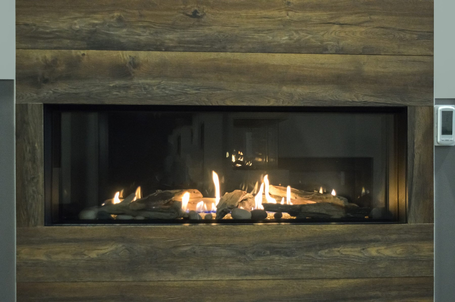 Sierra Flame Vienna gas fireplace installed in wood panel wall sierra flame gas fireplace